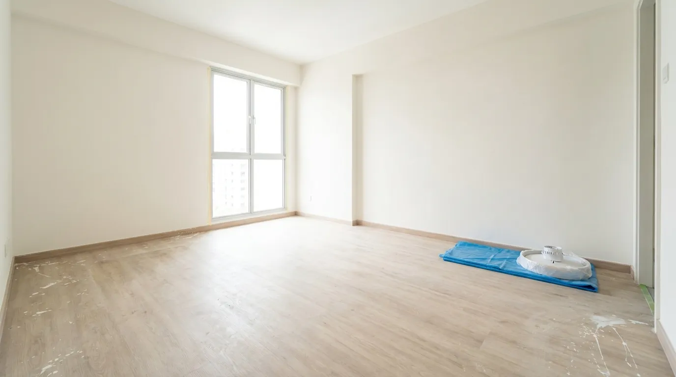 Freshly renovated Singapore HDB living room with construction dust on the floor, unfurnished and awaiting deep clean